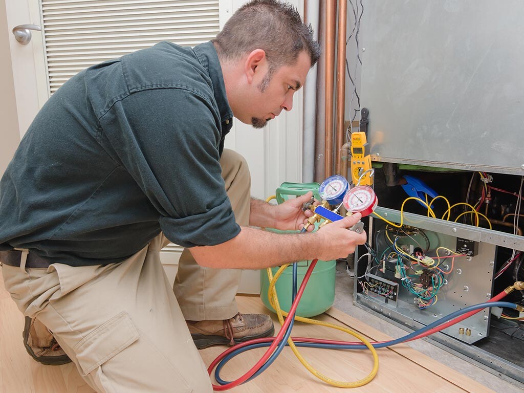 Man working with refrigerant