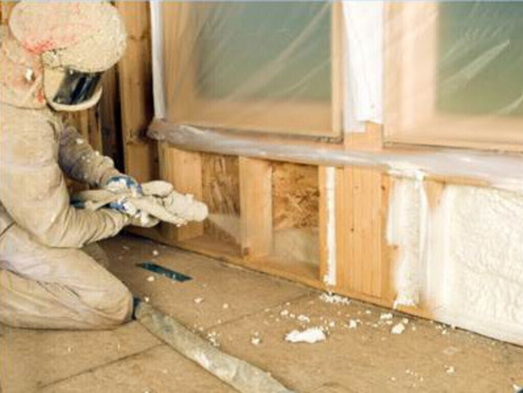 Worker spraying foam